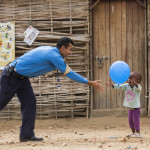 Members of the UNPOL Gender Child and Vulnerable Persons Protection (GCVPP) Unit visit the Temporary Learning Space in Protection of Civilians site 2 to play games with the children who attend school there.